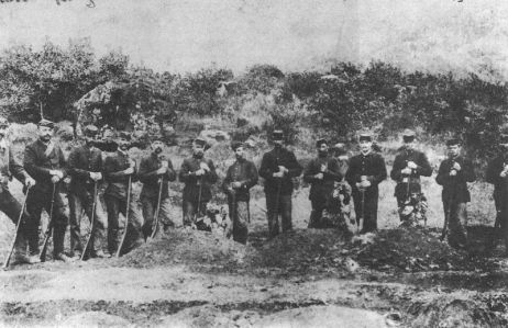 Company of Provisional Government troops burying the three soldiers killed by Ko'olau in the Kalalau Valley. 